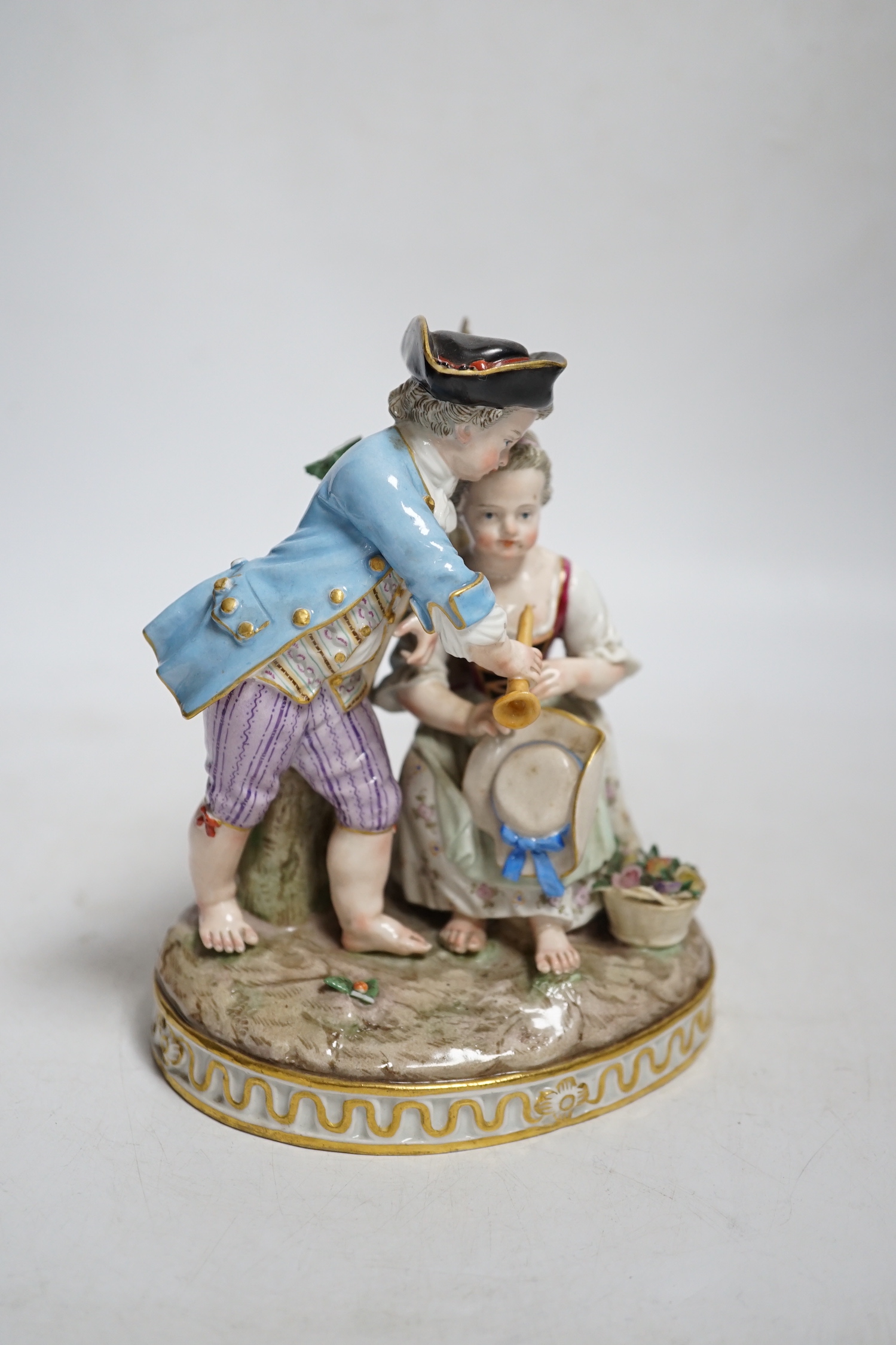 A Meissen group of a boy and a girl with a piccolo, 19th century